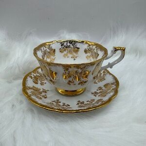 Royal Albert English Bone China tea cup & saucer. White china with gold flowers